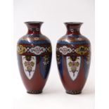 A pair of Japanese cloisonné vases, with red ground and floral decoration, 18.