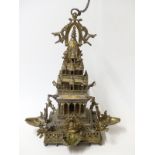 A late 19th / 20thC Tibetan / Indo Chinese / Hindu tiered temple with four figural trays for