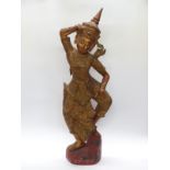 A carved and gilded Cambodian Kinnaris Temple Dancer with script to base,