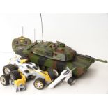 Remote control 1:16 scale model Abrams tank together with a remote control racing car with