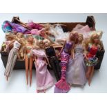 Approximately thirty Barbie dolls of differing ages