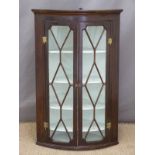 19thC mahogany bow fronted corner cupboard,