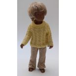 Sasha doll with brown lips, blue eyeshadow, blonde hair, brown sandals,