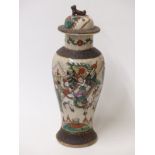 A 19th/20thC Chinese crackle glazed covered vase with warrior decoration and dog of fo finial