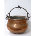 A copper cauldron with wrought iron fittings,