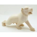 An early 20thC ivory lion