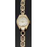 J W Benson 9ct gold ladies wristwatch with gold hands and Arabic numerals,