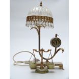 A combination clock lamp with drop lustre shade,