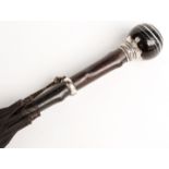 A 19thC parasol with spherical banded agate handle on white metal mount and suspension collar in