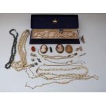 A collection of costume jewellery including a section of a Victorian ring,