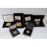 A collection of gold plated commemorative coins etc includes 'super size' 10oz and 5oz examples,