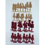 An 18thC French Dieppe bone figural chess set with carved pieces, one side stained red,
