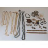 A collection of costume jewellery to include silver rings, Victorian silver brooch, silver bracelet,