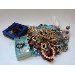 A collection of jewellery including beads
