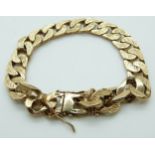A gentleman's 9ct gold curb link bracelet with textured finish, 45.
