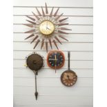 A c1950/1960 sunburst wall clock by Paico together with a Dupont frying pan wall clock,