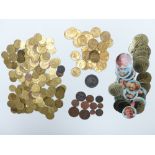 A large collection of Victorian brass counters together with some modern fruit machine tokens,