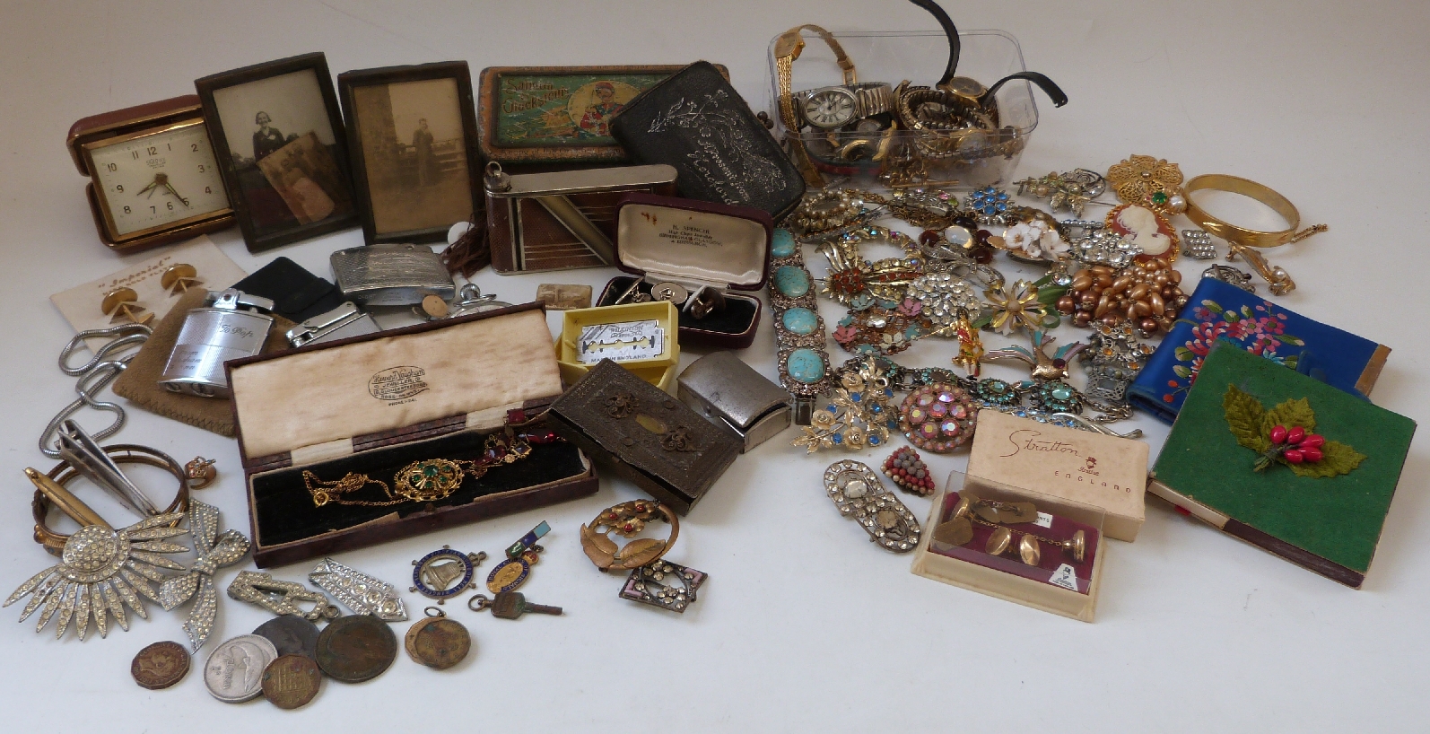 A collection of costume jewellery to include brooches, necklaces, Ronson lighter, watches,