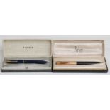 Two Parker fountain pens comprising a Slimfold with blue barrel and cap,