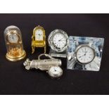 A collection of collectable modern pocket watches together with a group of miniature clocks,