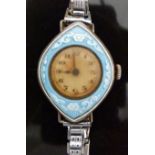 Ladies silver wristwatch with floral decorated blue guilloche enamel bezel, and Arabic numerals,