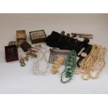 A collection of costume jewellery including a Victorian banded agate hat pin, jadeite pendants,