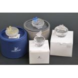 Four Swarovski Crystal cut glass trinket boxes, largest 6cm in diameter,