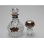 Hallmarked silver collared cut glass decanter,