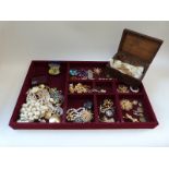 A large tray of costume jewellery including Avon, Monet, Ciro, earrings,
