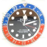 Rolex jewellers' display wall clock, 'Oyster Perpetual Date' to black dial, blue and red steel case,