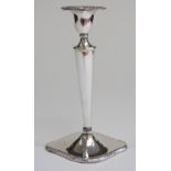 An early 20thC candlestick, marks rubbed,