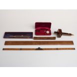 Tools and scientific instruments including a brass inlaid rosewood, mortice gauge, folding ruler,