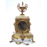French 19thC brass mantel clock, the black Roman dial with gilt brass beetle and poker hands,