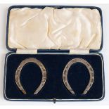 Cased pair of George VI novelty hallmarked presentation miniature horseshoes,