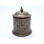 A 19thC brass tobacco jar with lead tamper, mark possibly for Adolf Frankau and Co to base,