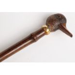 Late 19thC parasol with carved figural duck handle, yellow metal collar impressed 'Brigg',