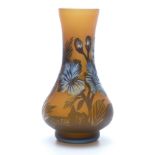 Galle style cameo glass vase with blue flowers on a burnt orange ground, 14.5cm tall.