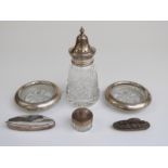 Hallmarked silver and cut glass sugar sifter, two white metal-mounted coasters marked sterling,