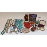 A collection of costume jewellery to include agate necklaces, white metal bangle,