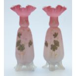A pair of Victorian glass vases with hand decoration and crimped rims,