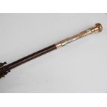 A late 19thC/20thC parasol with 15ct gold handle and collar and hardwood stick,