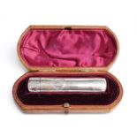 A cased Victorian hallmarked silver double ended scent bottle and vinaigrette with gilt interior,