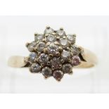 A 9ct gold ring set with paste in a cluster,