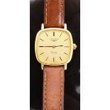 Longines gold plated ladies wristwatch with gold face, black hands, two tone baton hour markers,