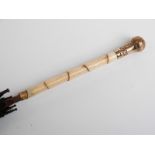 Victorian parasol with 15ct gold repoussé decorated handle with carved ivory and hardwood stick,