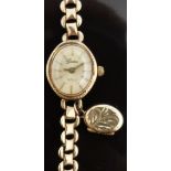 Ladies 9ct gold wristwatch with gold hands, baton markers and face and quartz movement,