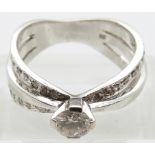 A 14ct white gold ring set with a round brilliant cut diamond of approximately 0.