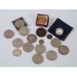 An 1885 silver dollar, crowns, silver £1 coin,