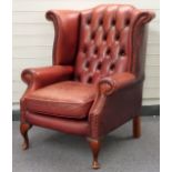 Leather wing-backed armchair