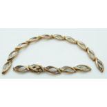 A 9ct gold section of bracelet set with diamonds,